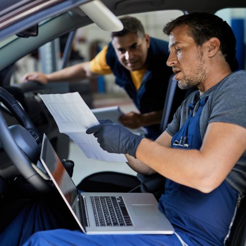 auto-mechanic-and-his-coworker-car-s-performance-i-2023-11-27-04-58-38-utc-1.jpg